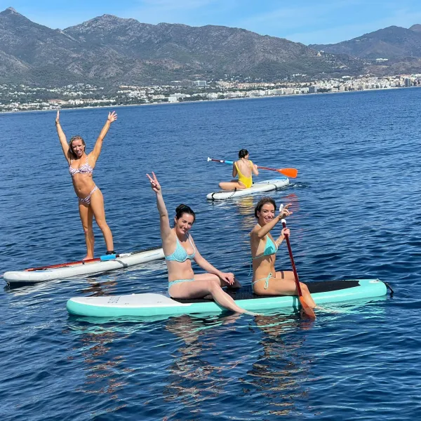 a group of people swimming in a body of water