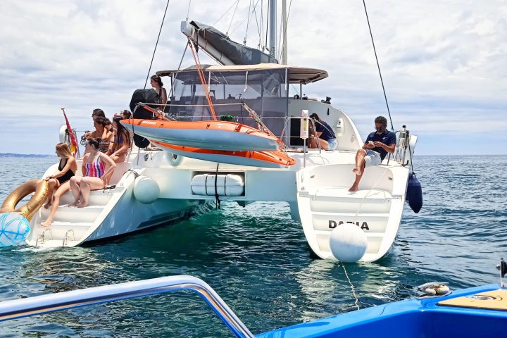 a group of people on a boat in the water