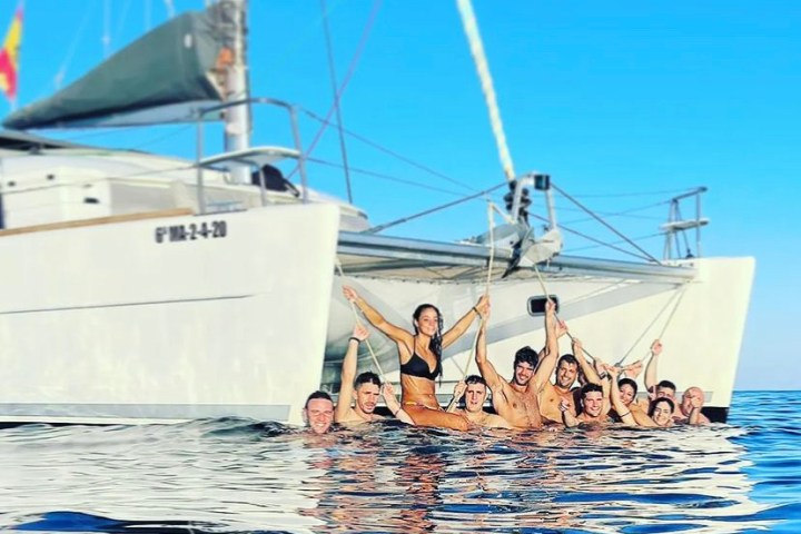 a group of people on a boat in the water