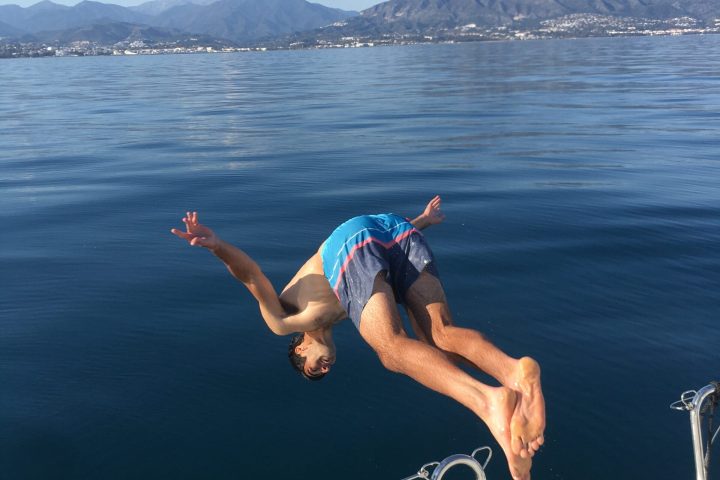 a person standing in front of a body of water
