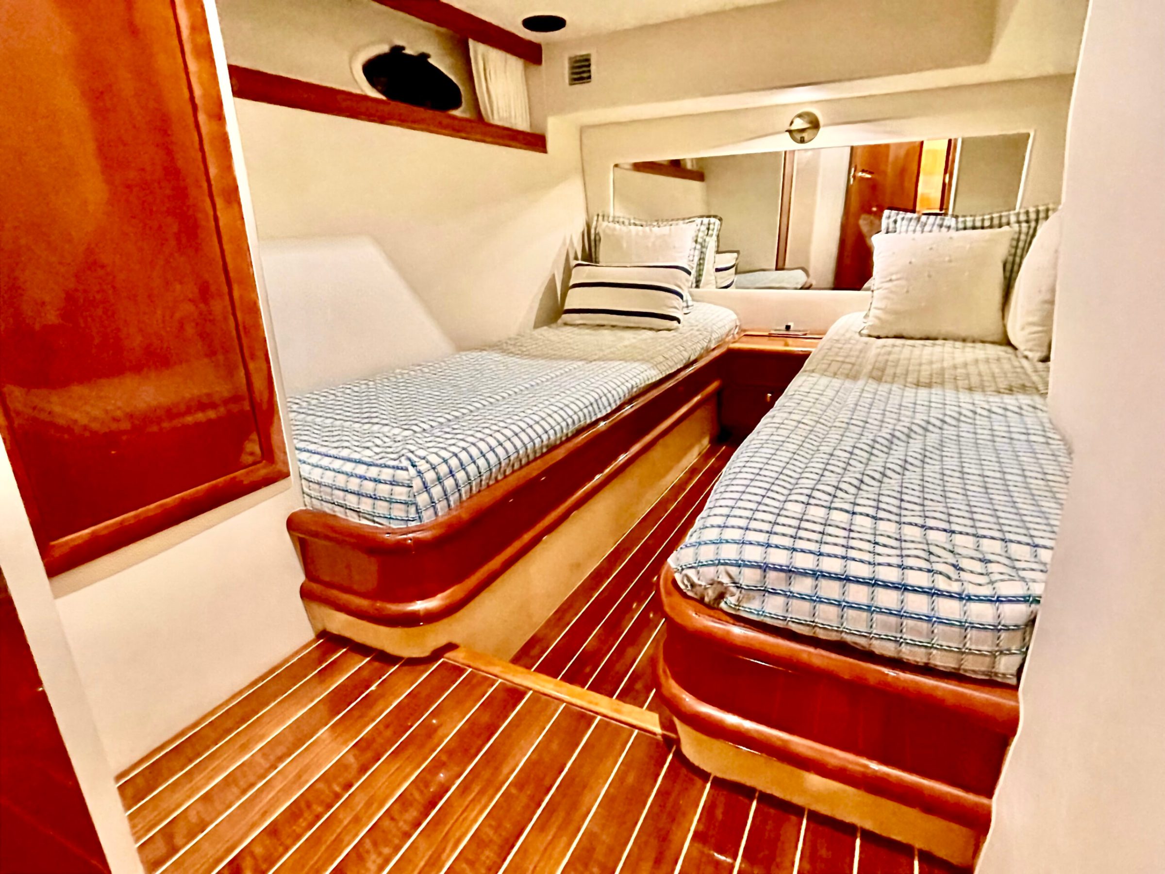 a bedroom with a bed and a chair in a room