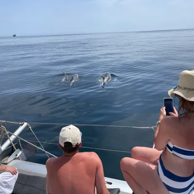 a couple of people that are standing in a body of water