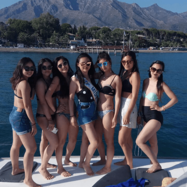 a group of young women in a boat