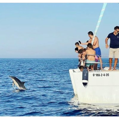 a person standing next to a body of water