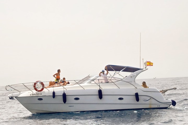 a group of people on a boat in the water