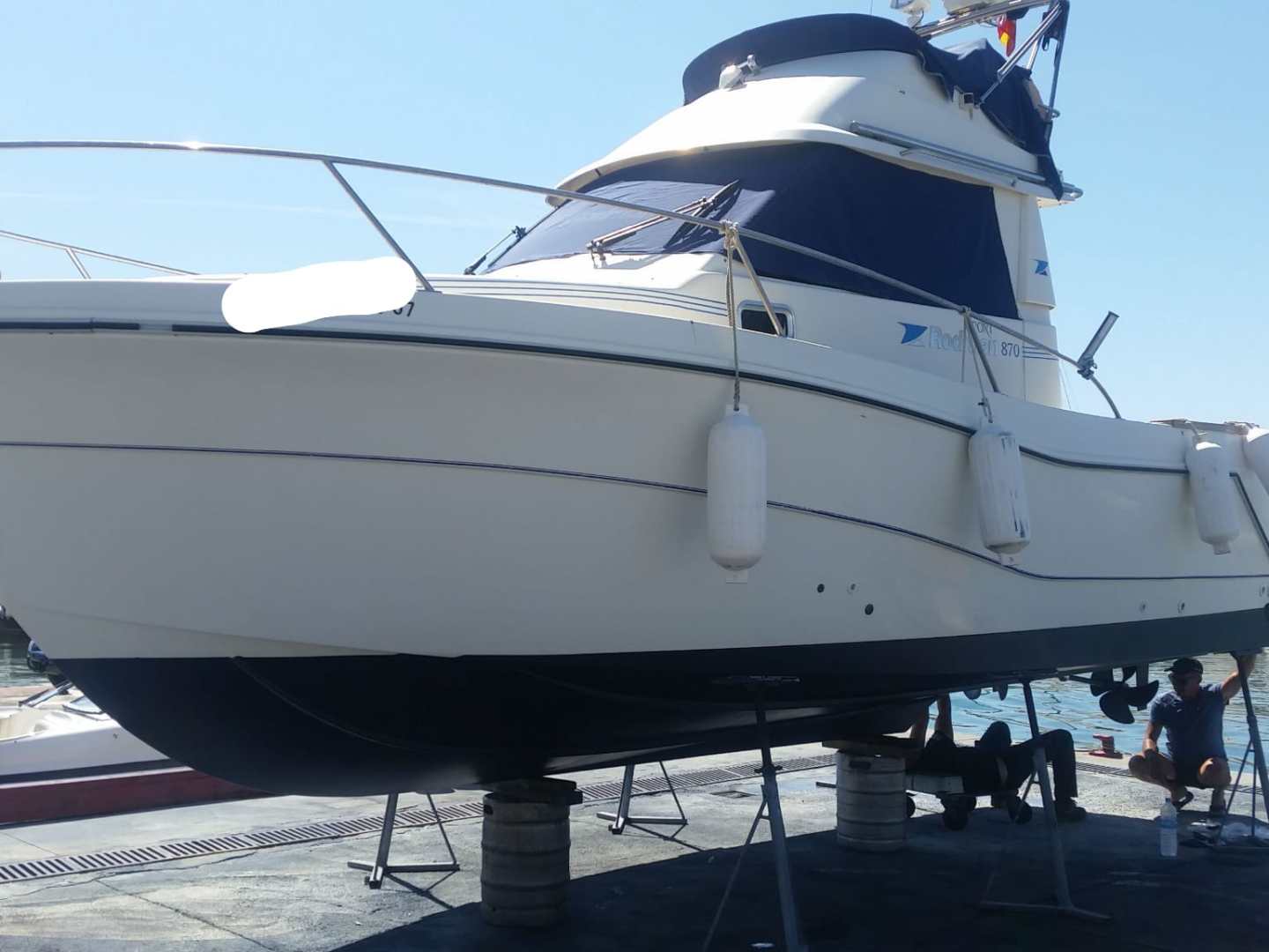 a boat is docked next to a body of water