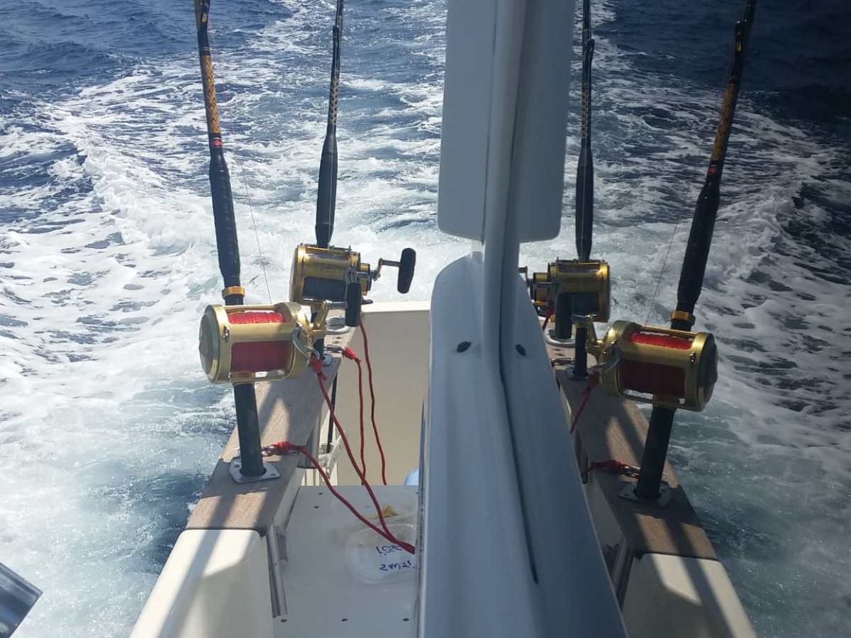 a boat is docked next to a body of water