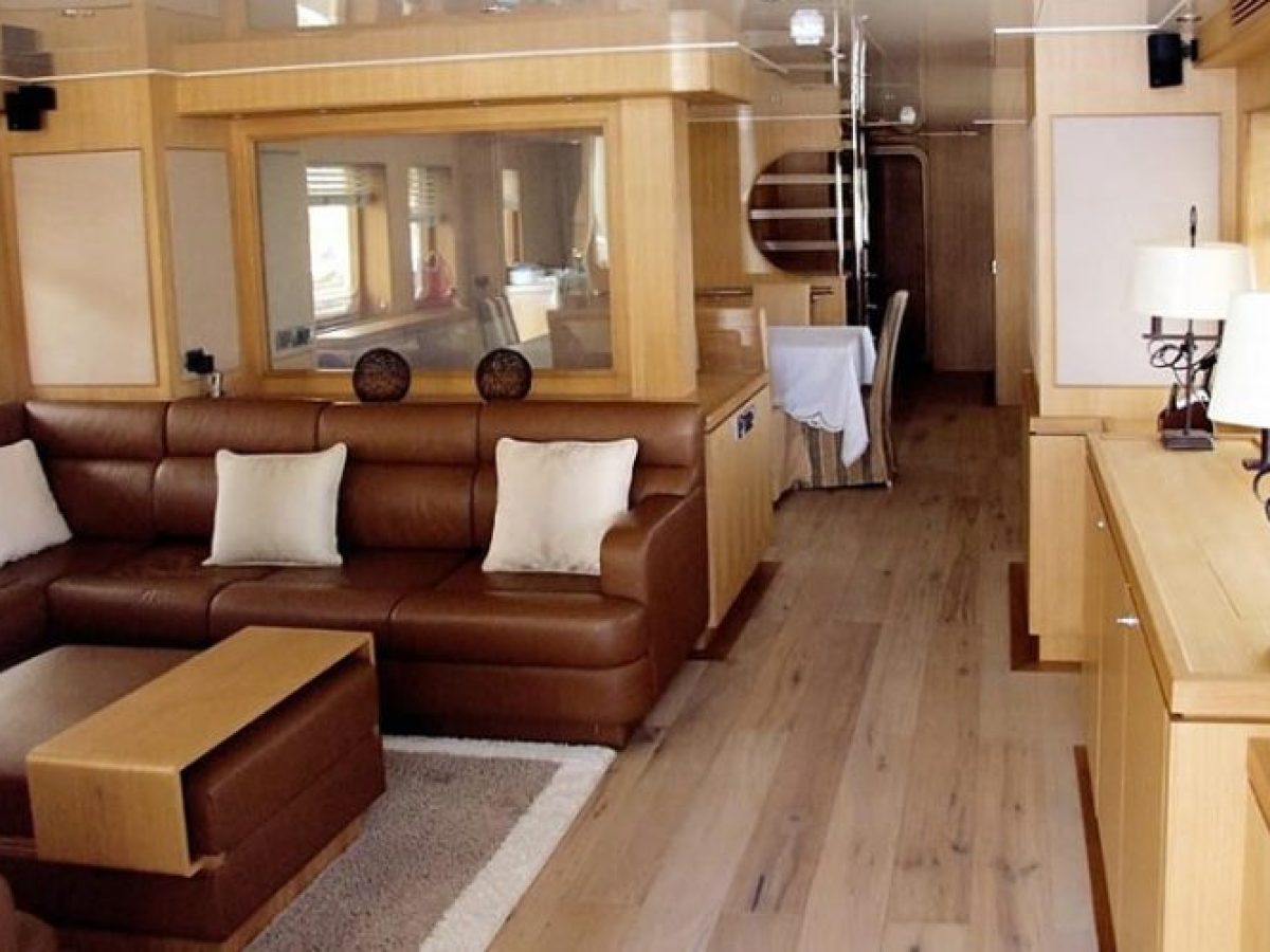a view of a living room filled with furniture and a wood floor