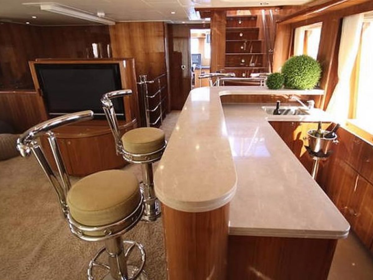 a kitchen with a table and looking at the camera