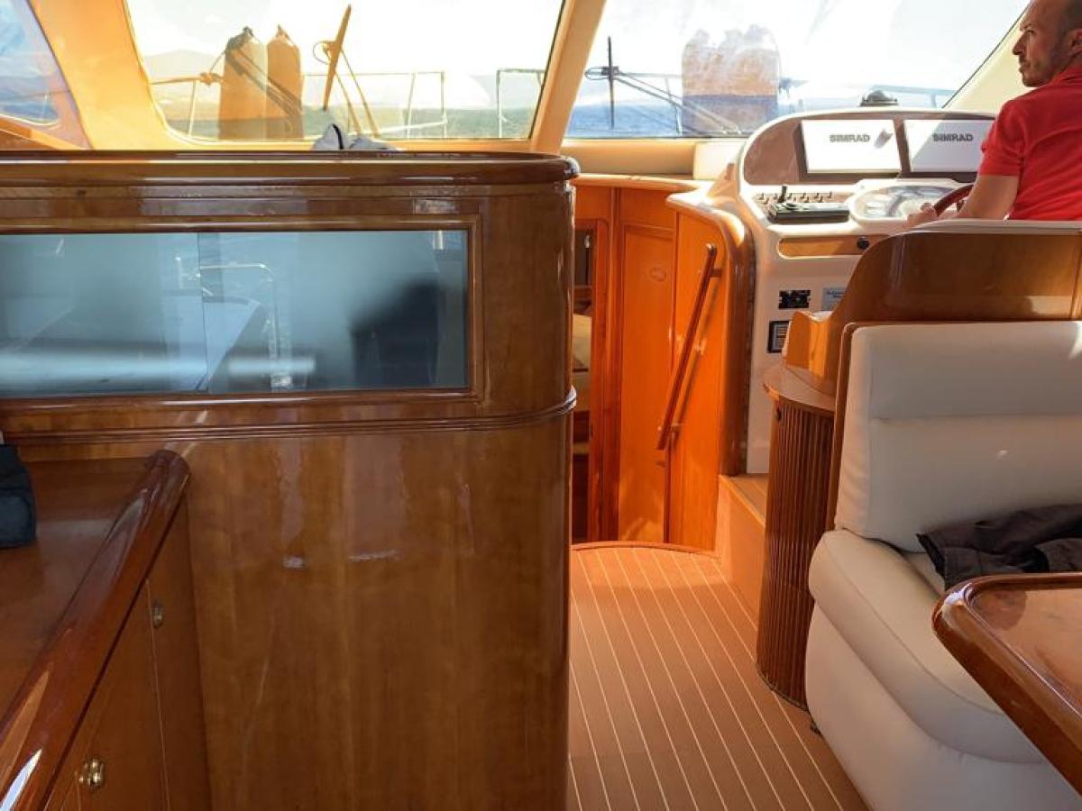 a person sitting at a table in front of a window