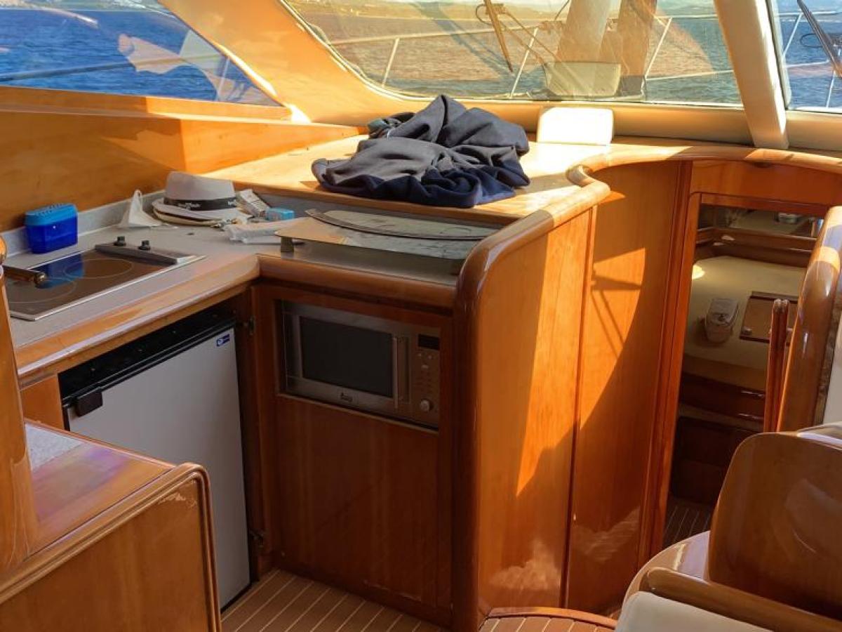 a stove top oven sitting inside of a kitchen
