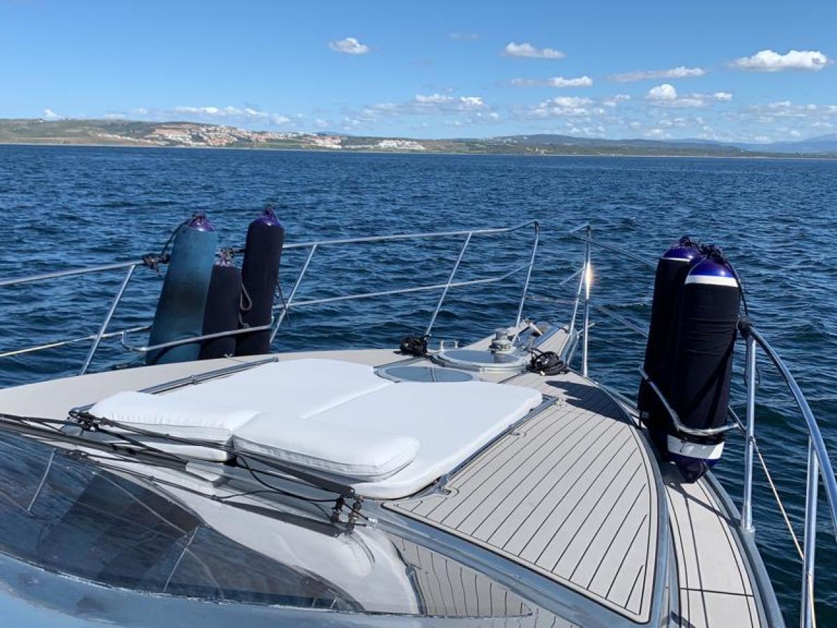 a close up of a boat next to a body of water
