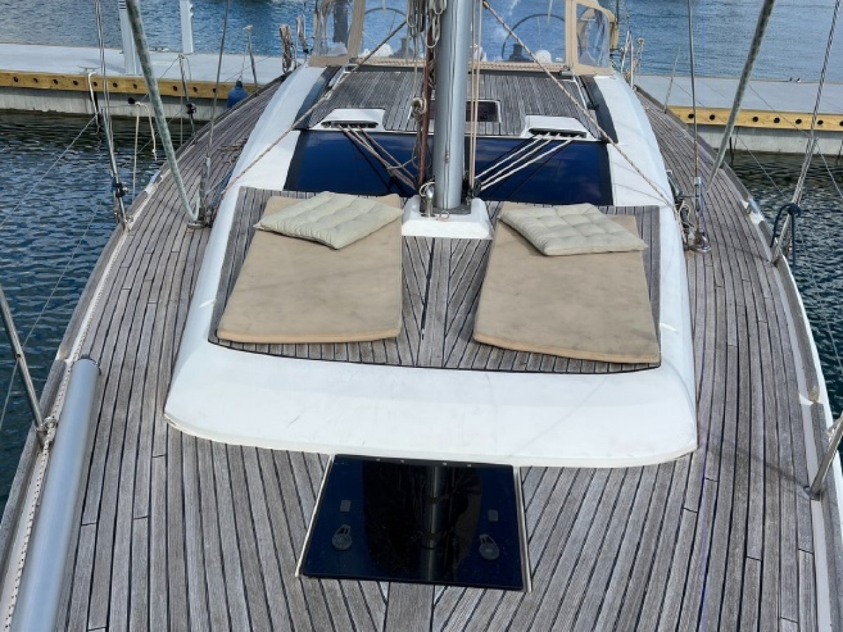 a boat is docked next to a body of water
