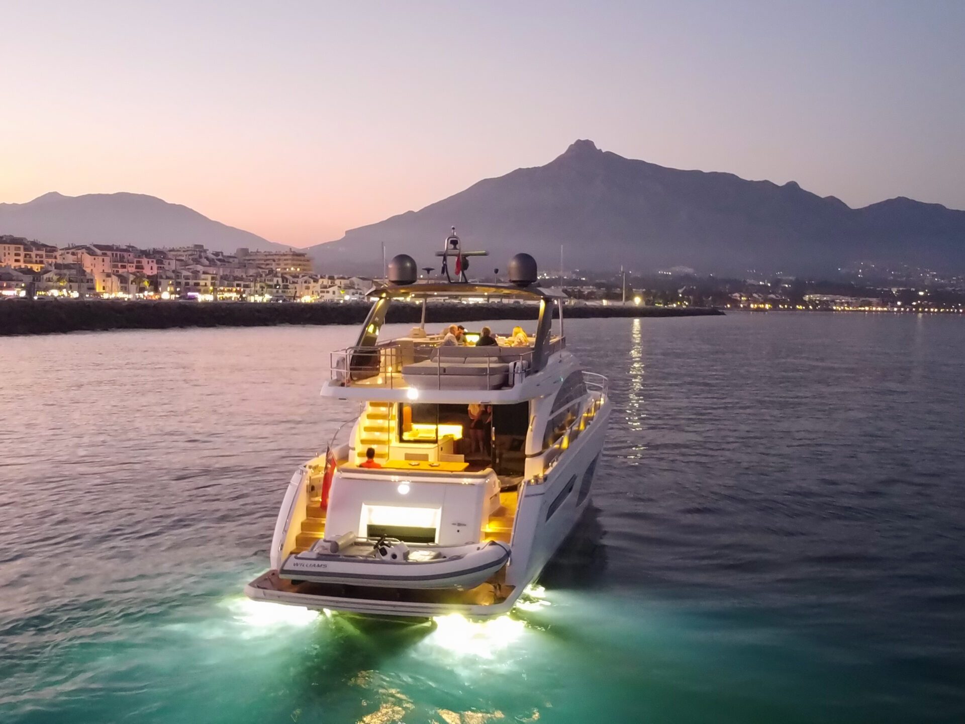 a boat traveling along a river next to a body of water