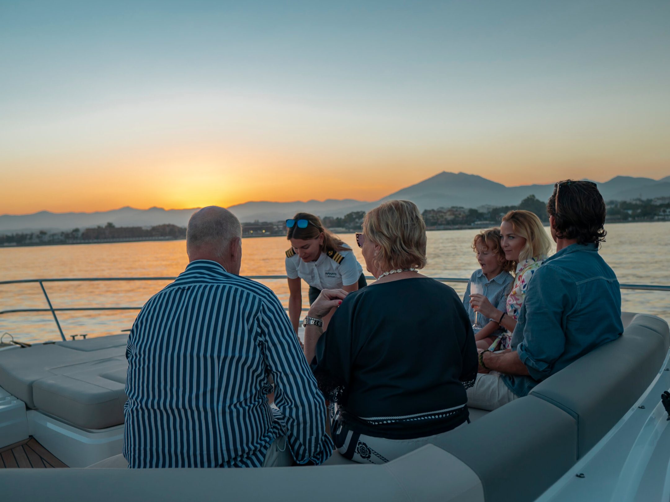 a group of people sitting at a beach