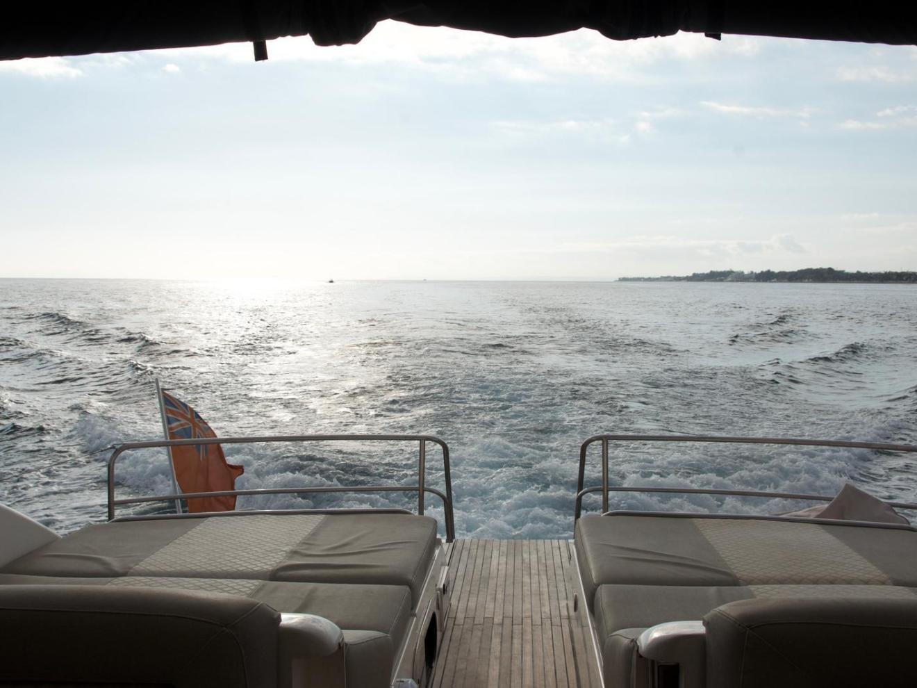 a chair sitting in front of a body of water