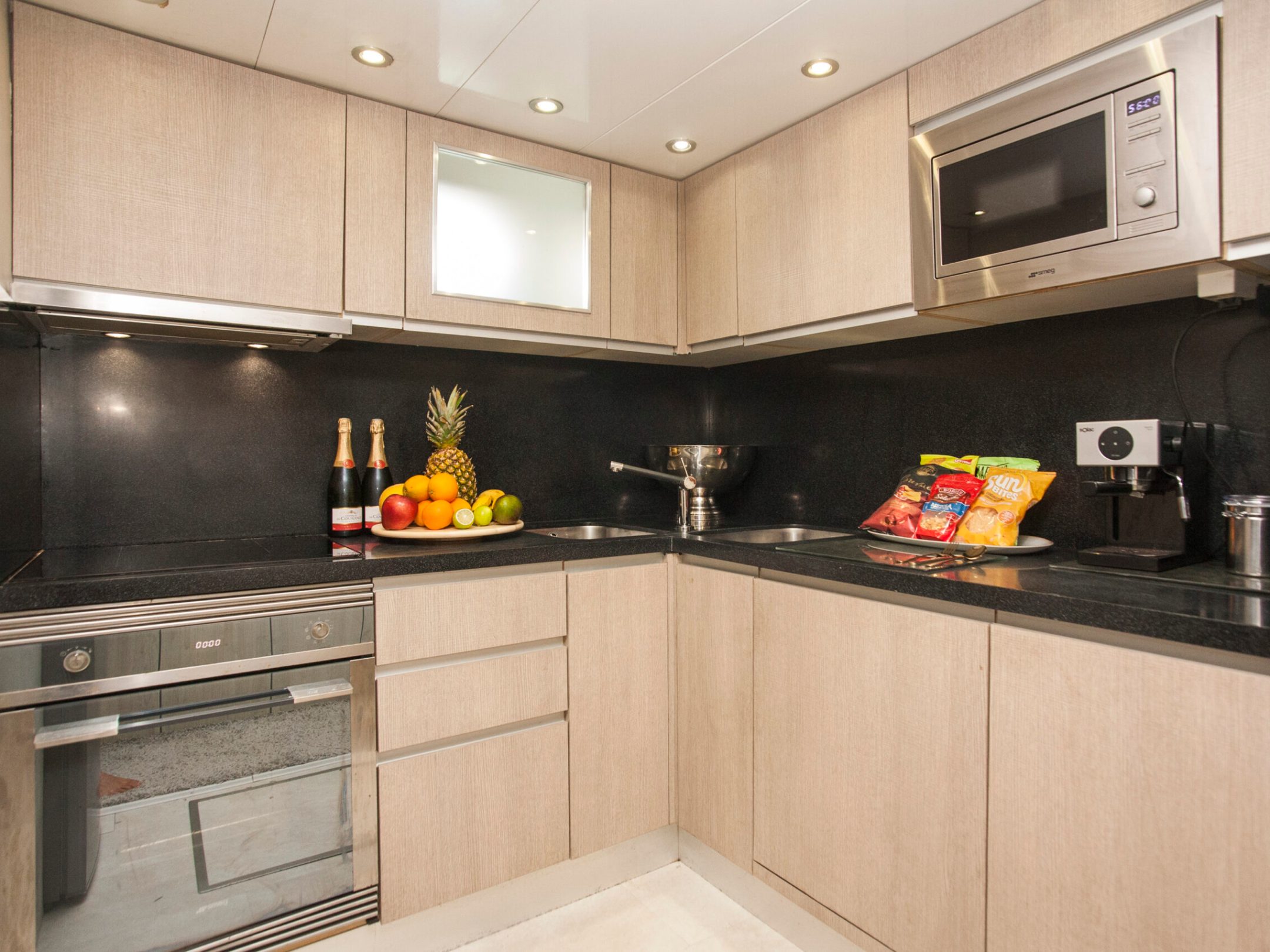 a kitchen with a sink and a microwave