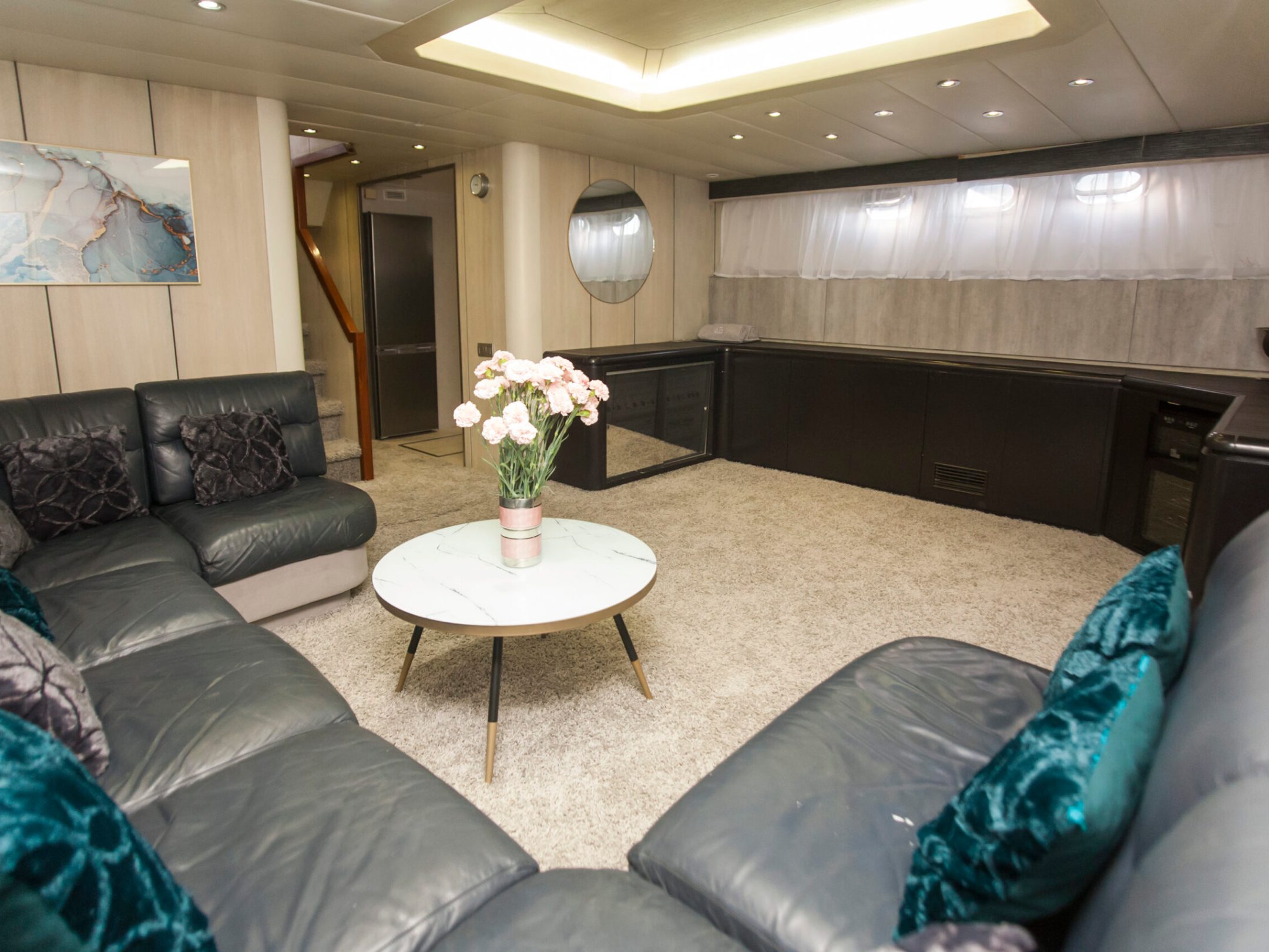 a bedroom with a bed and a chair in a room