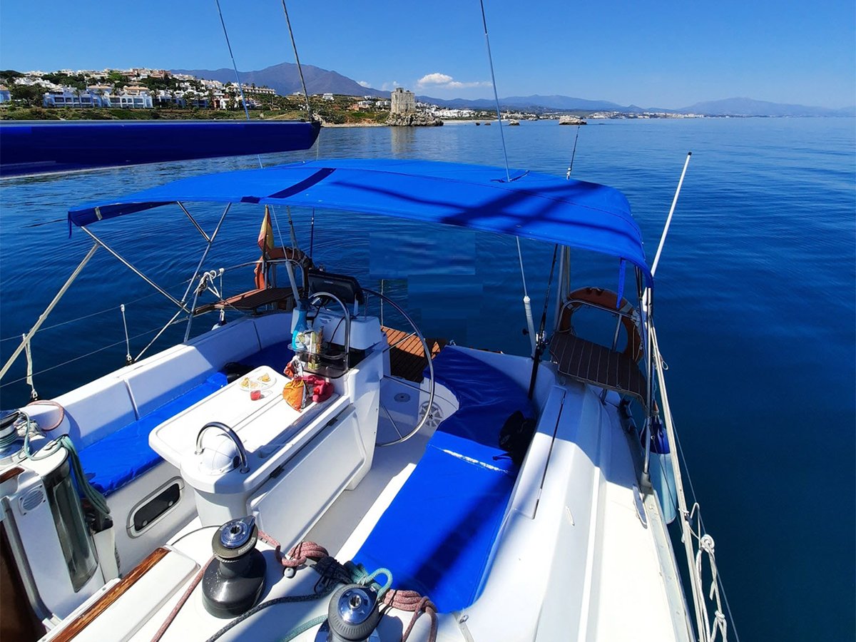 a boat is docked next to a body of water