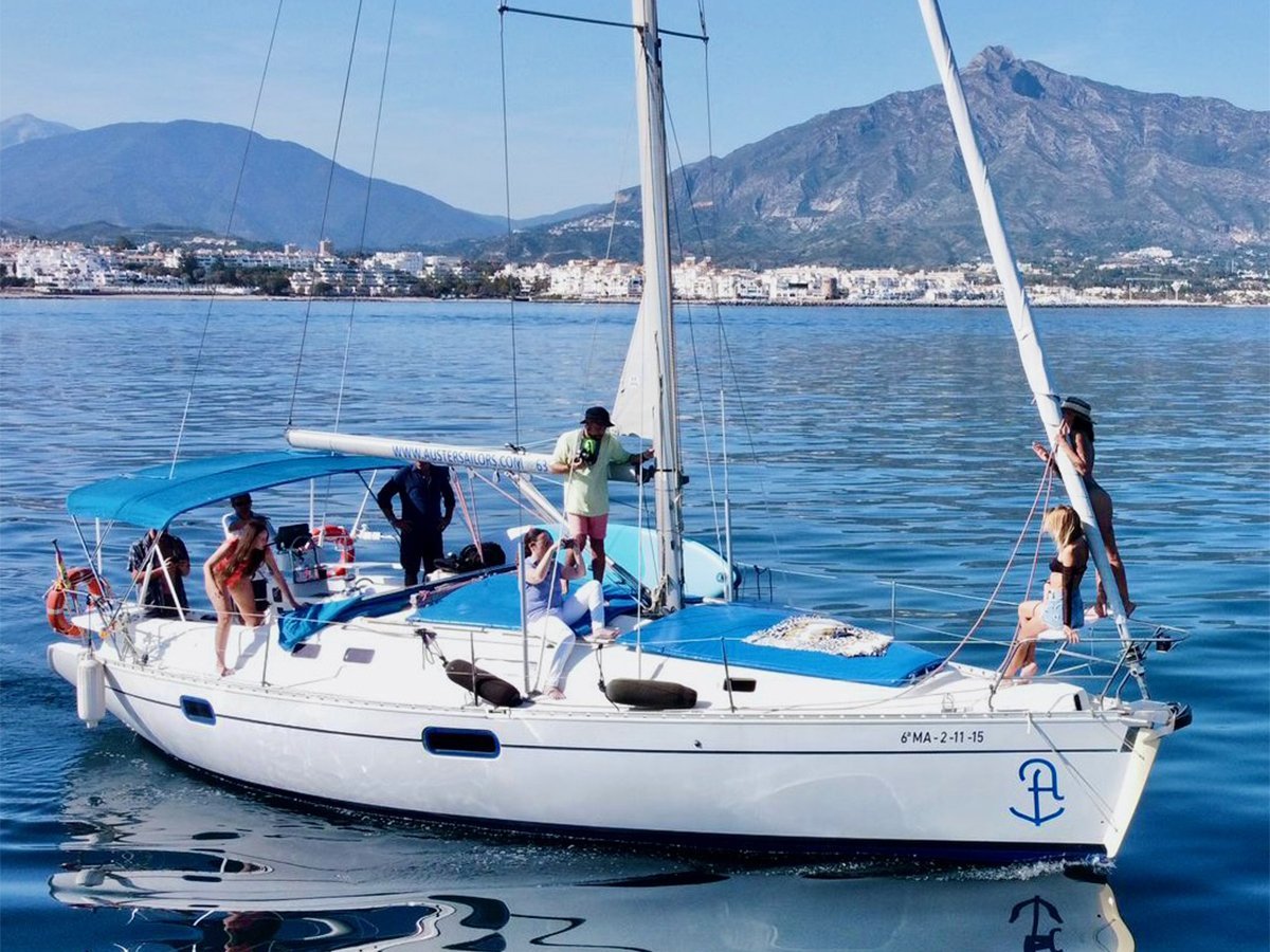 a group of people on a boat in a large body of water