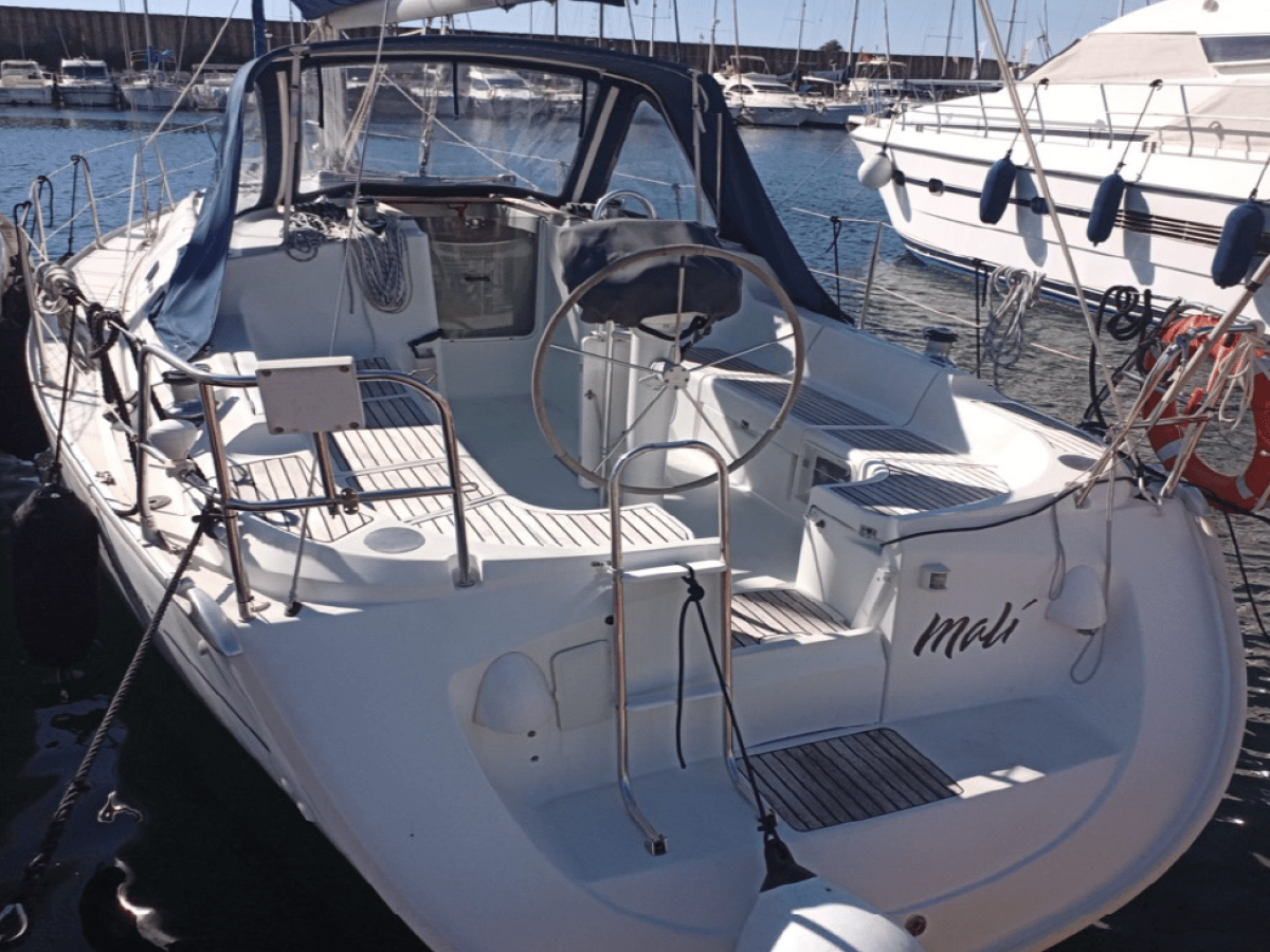 a boat is docked next to a body of water