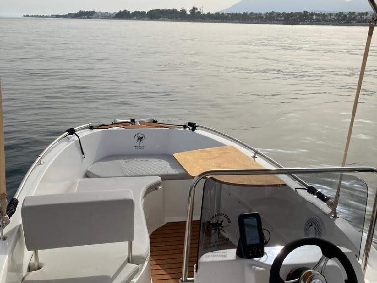 a boat parked next to a body of water