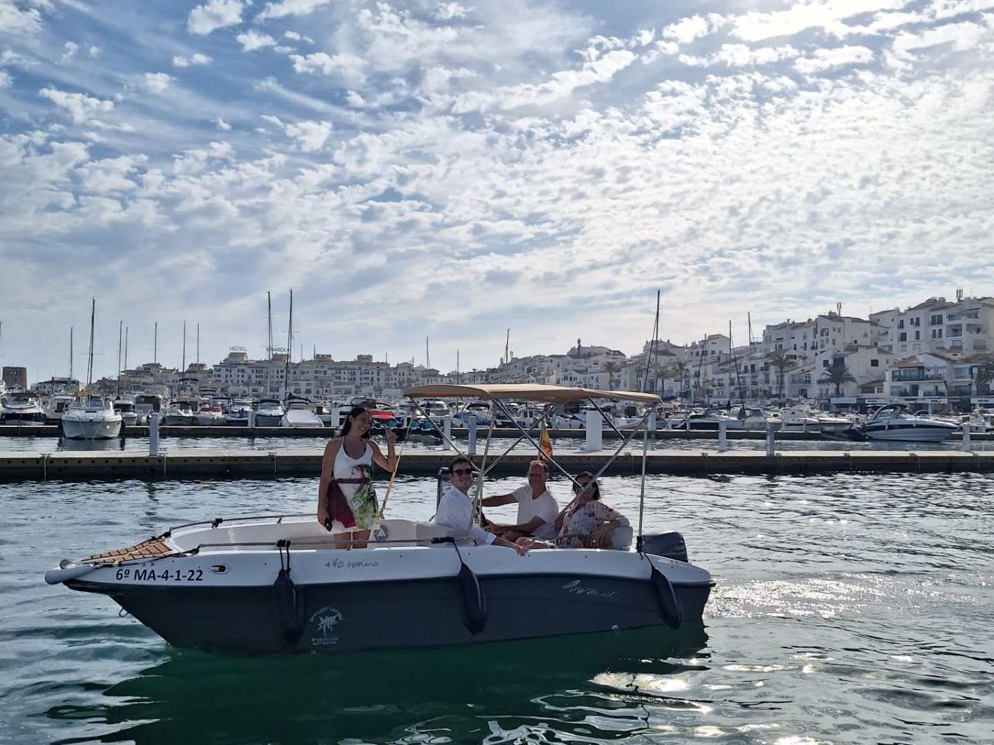 a group of people on a boat in the water