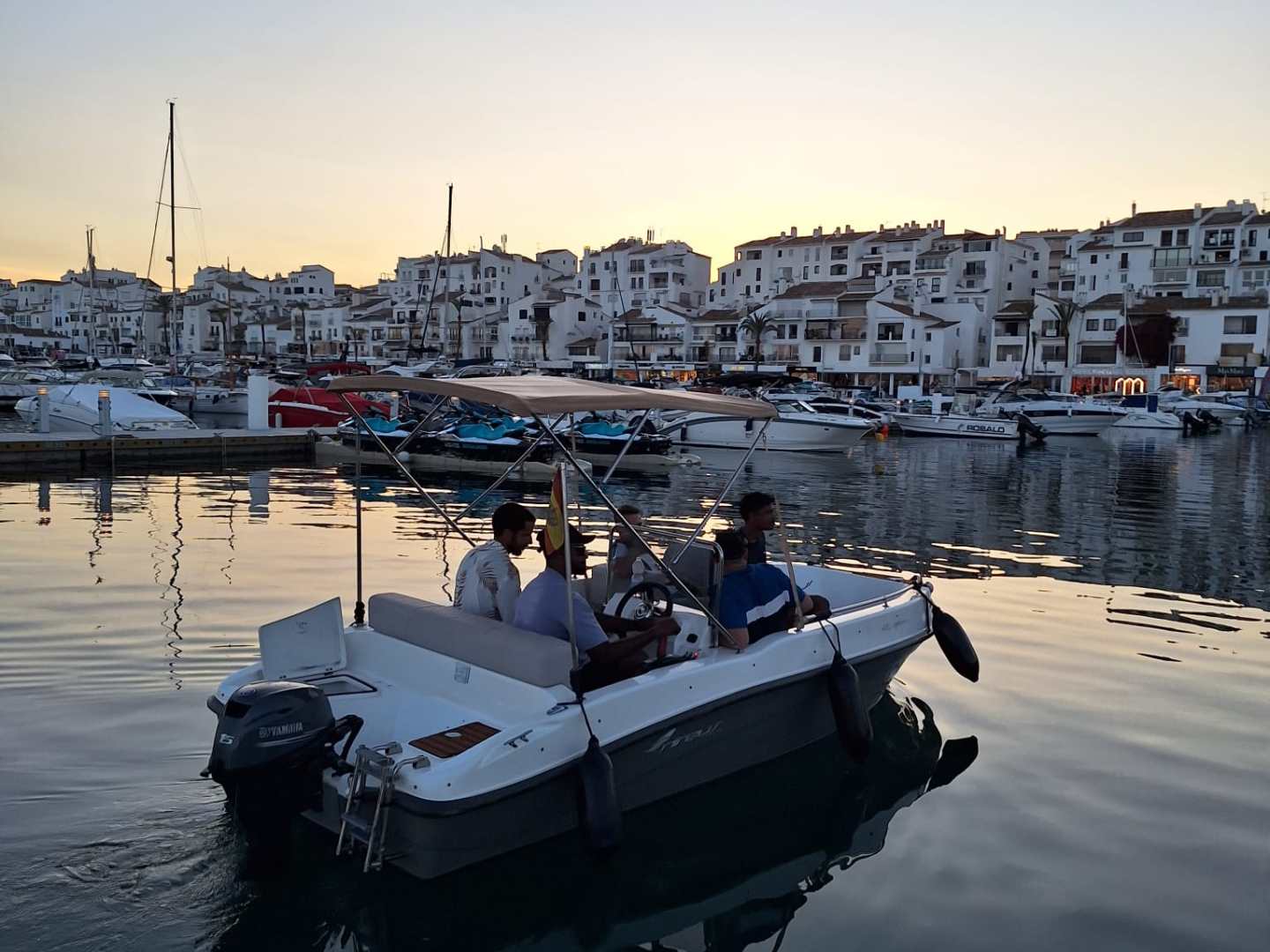 a boat is docked next to a body of water