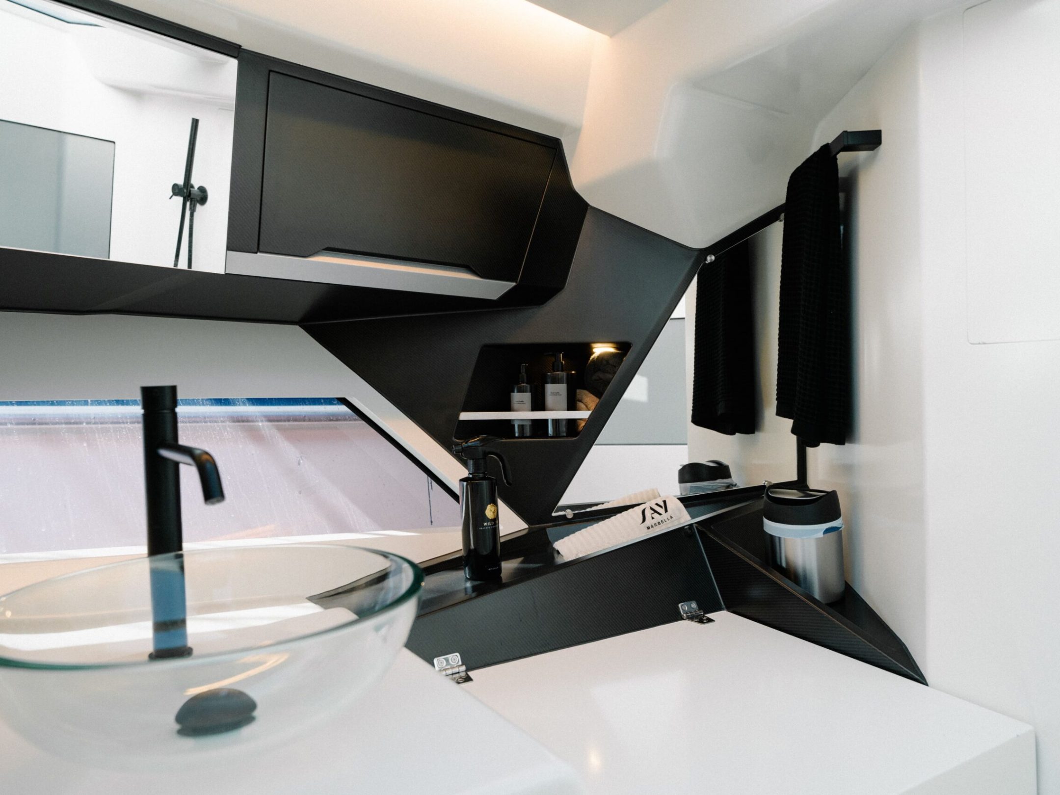 a room with a sink and a mirror
