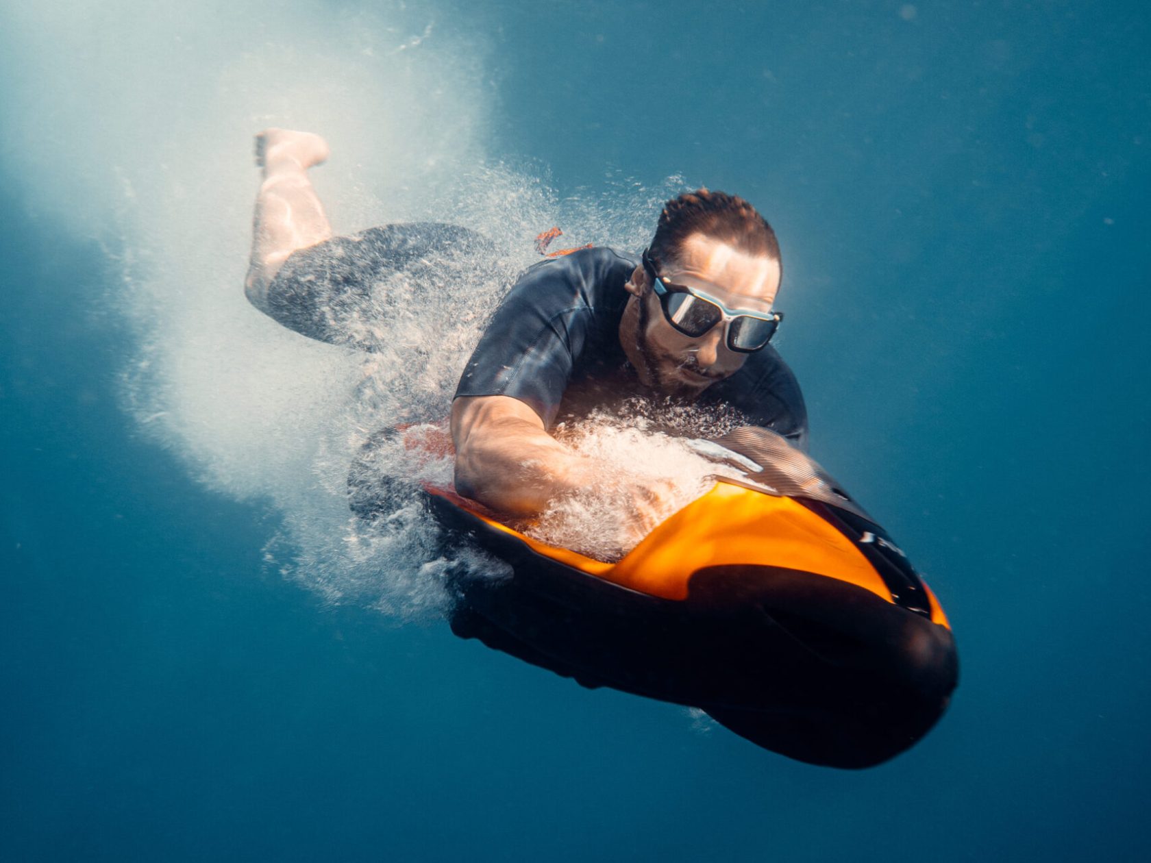 a man riding a wave on top of a body of water