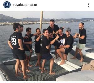 a group of people on a beach posing for the camera