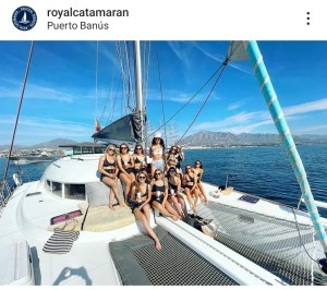 a group of people in a boat on a body of water