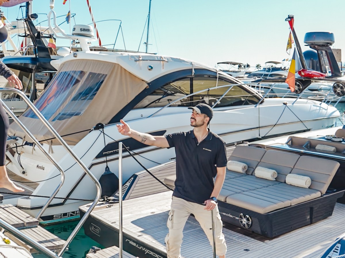 a person standing next to a boat