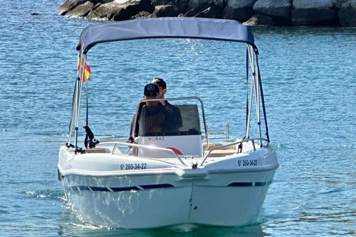a small boat in a large body of water