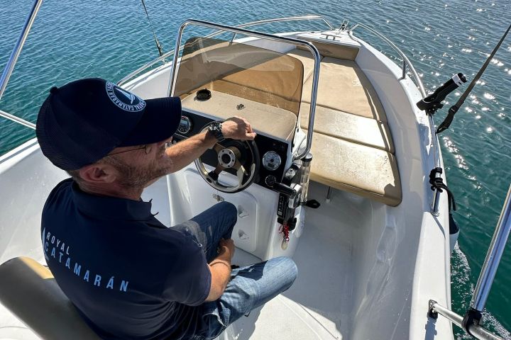 a person sitting on a boat in the water