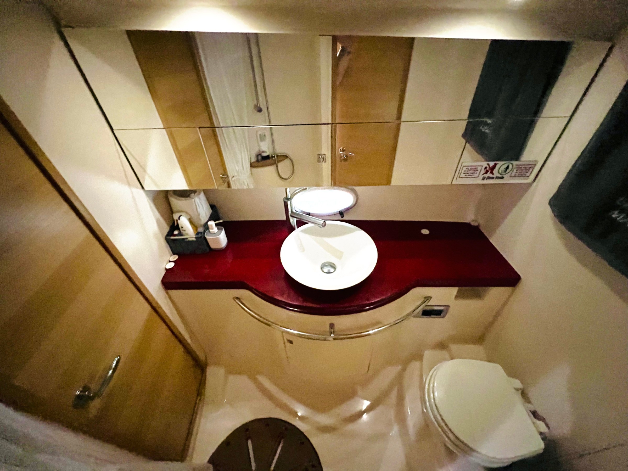 a room with a sink and a mirror