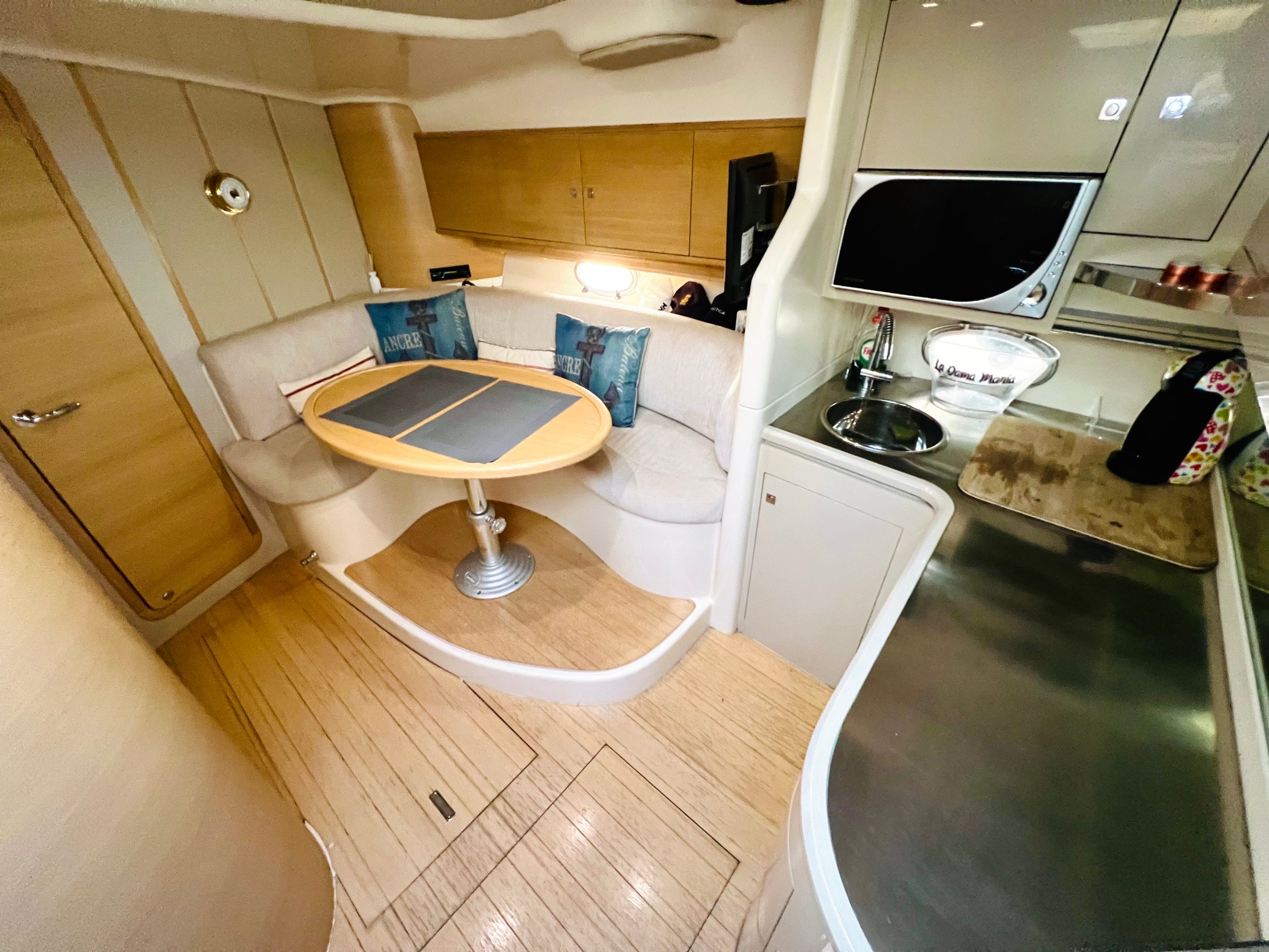 a microwave oven sitting on top of a wooden table