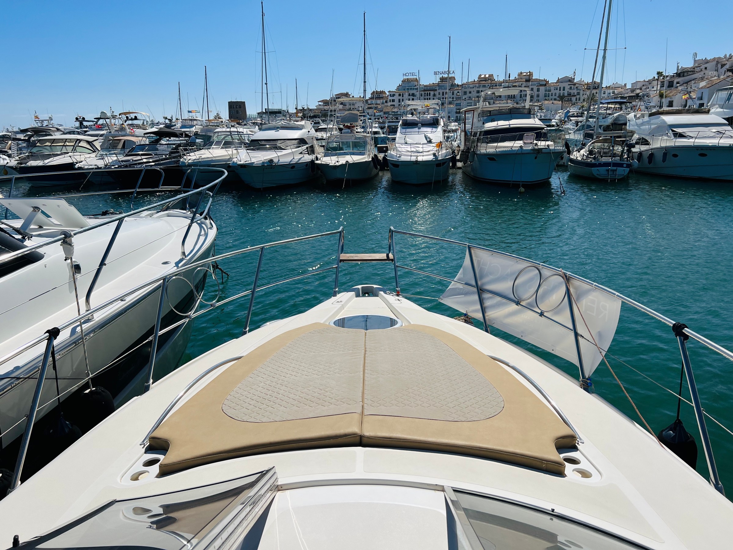 a boat is docked next to a body of water