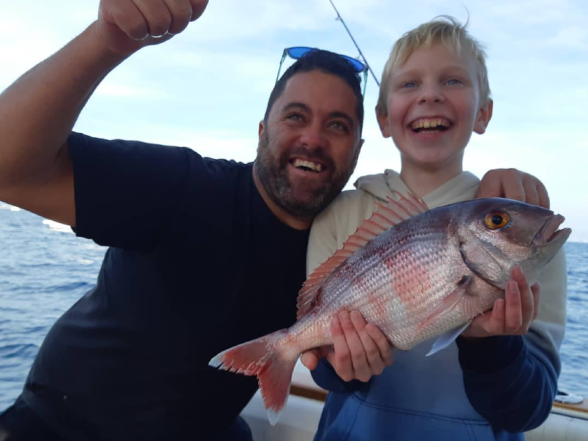 a person holding a fish