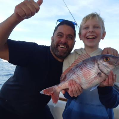 a person holding a fish
