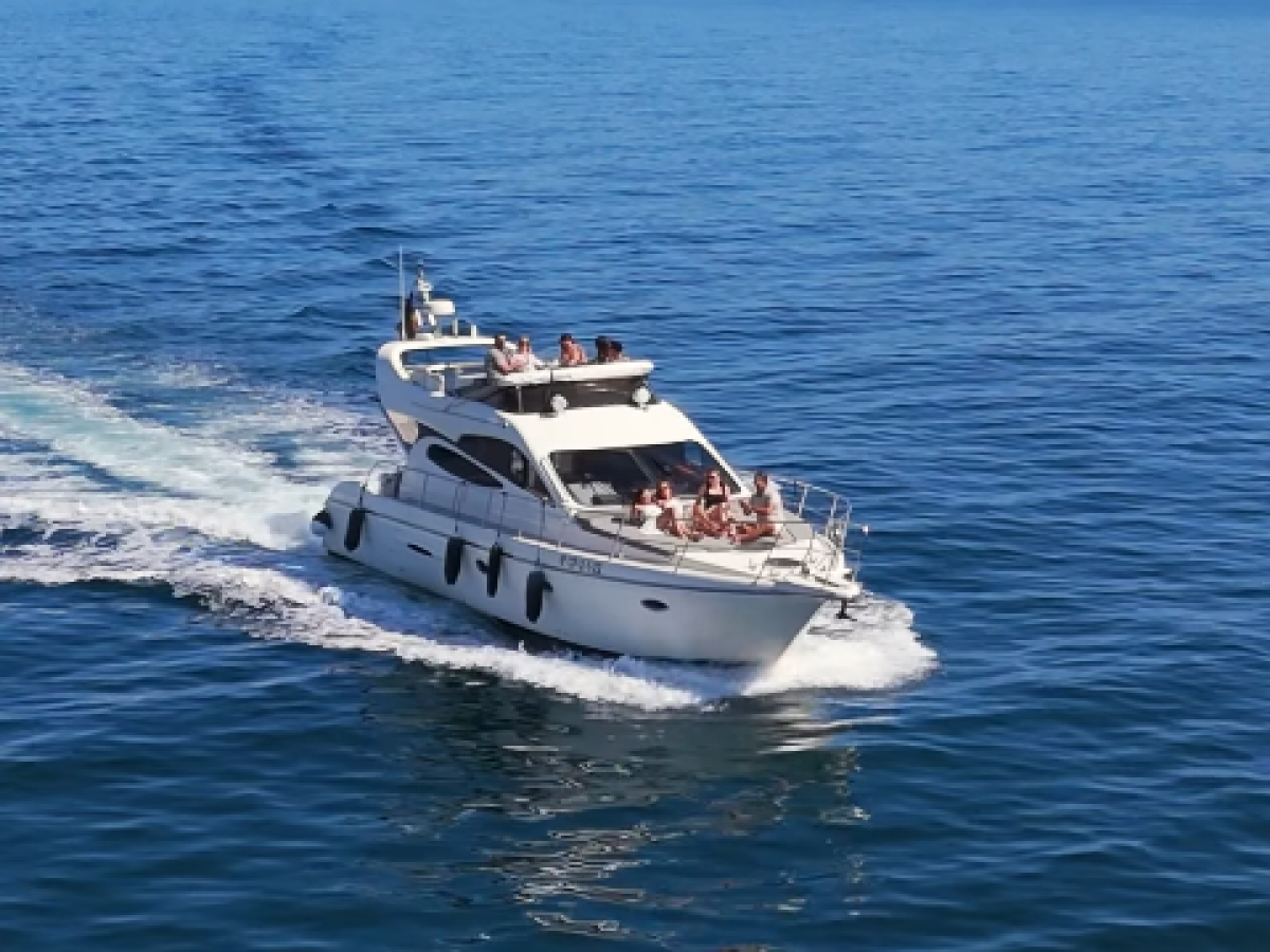 1728550941610 a small boat in a body of water