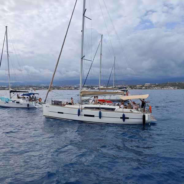 a group of people in a boat on a body of water