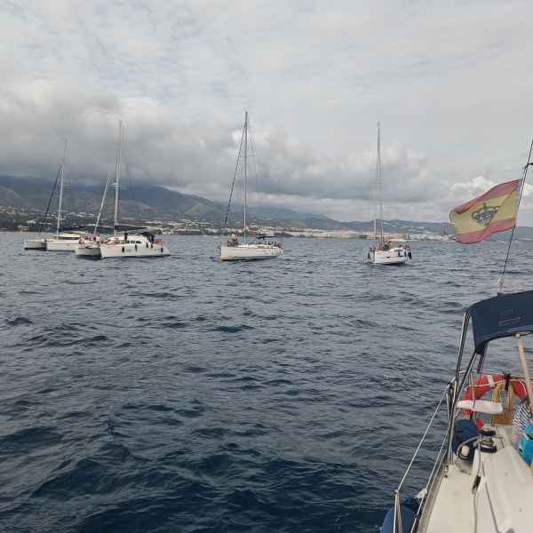 a group of people in a boat on a body of water