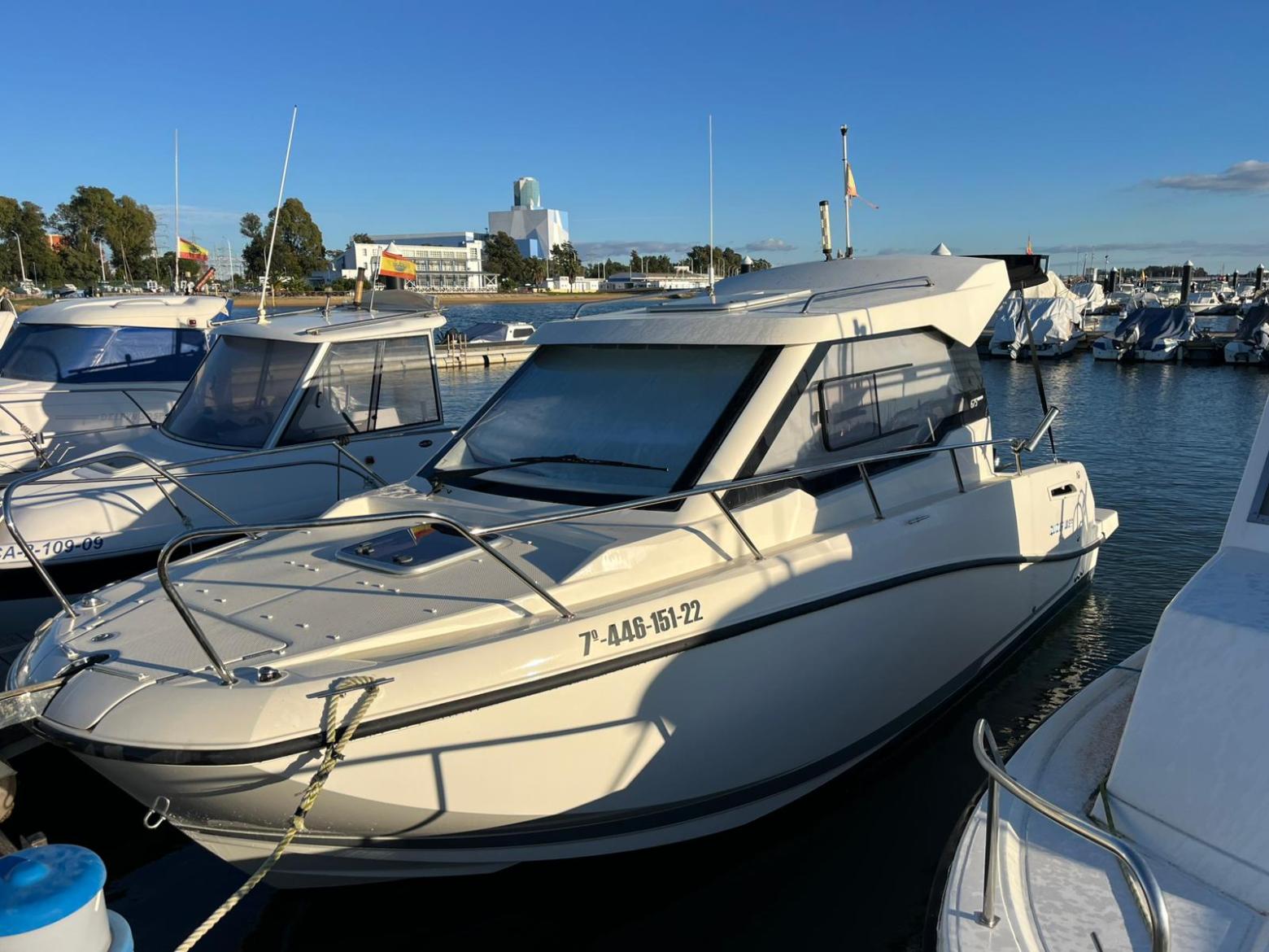 a boat is docked next to a body of water