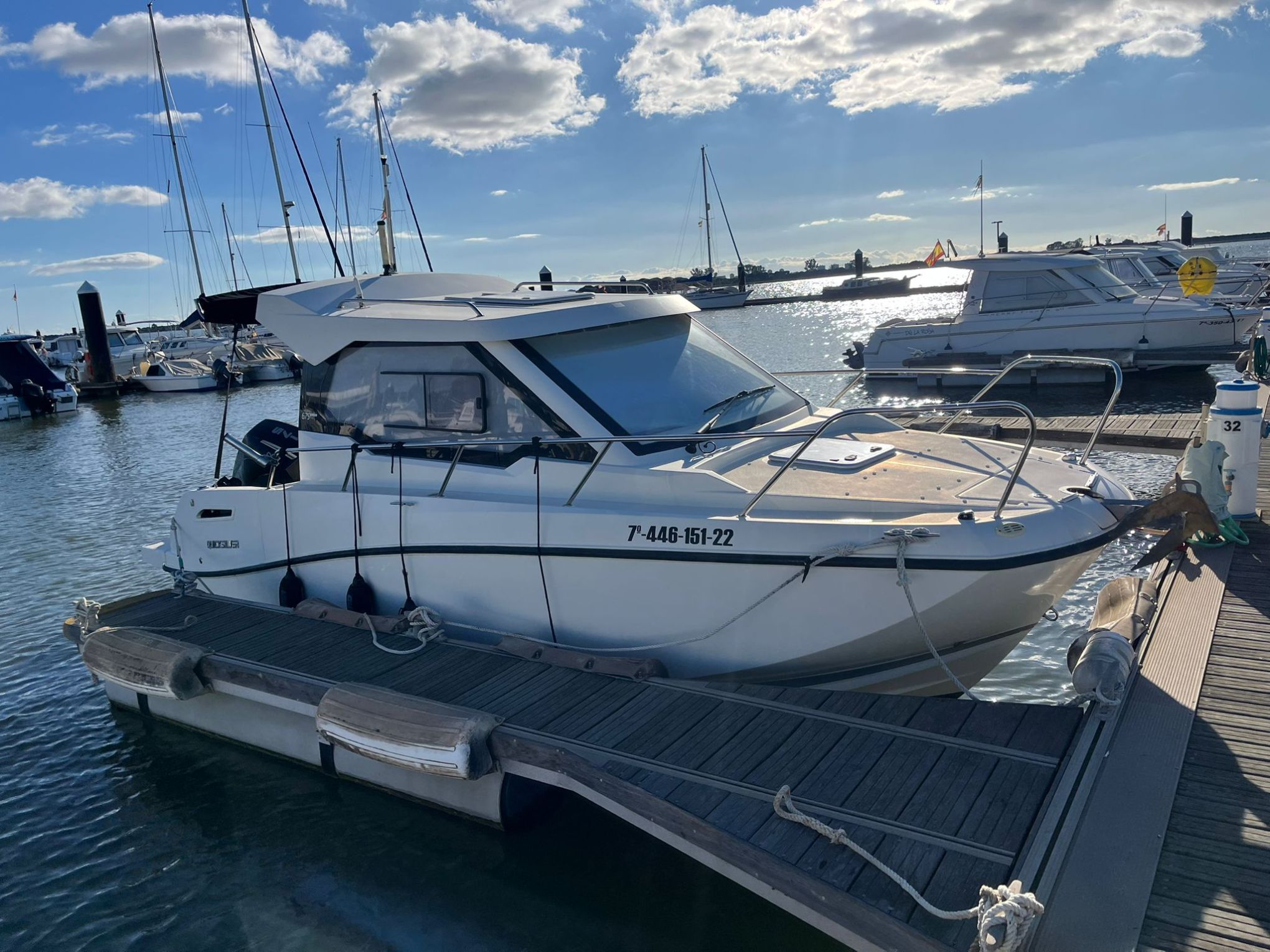a boat is docked next to a body of water