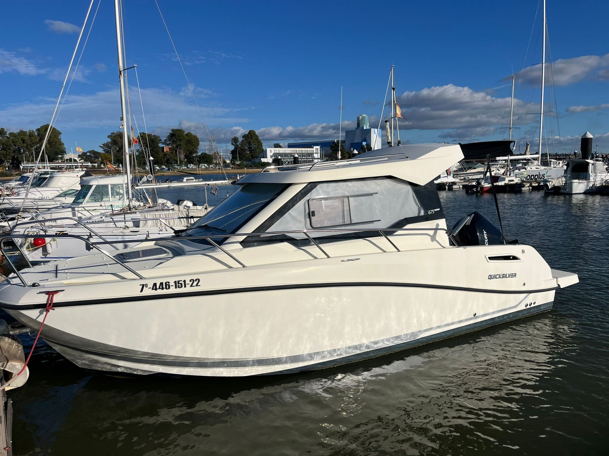 a boat is docked next to a body of water