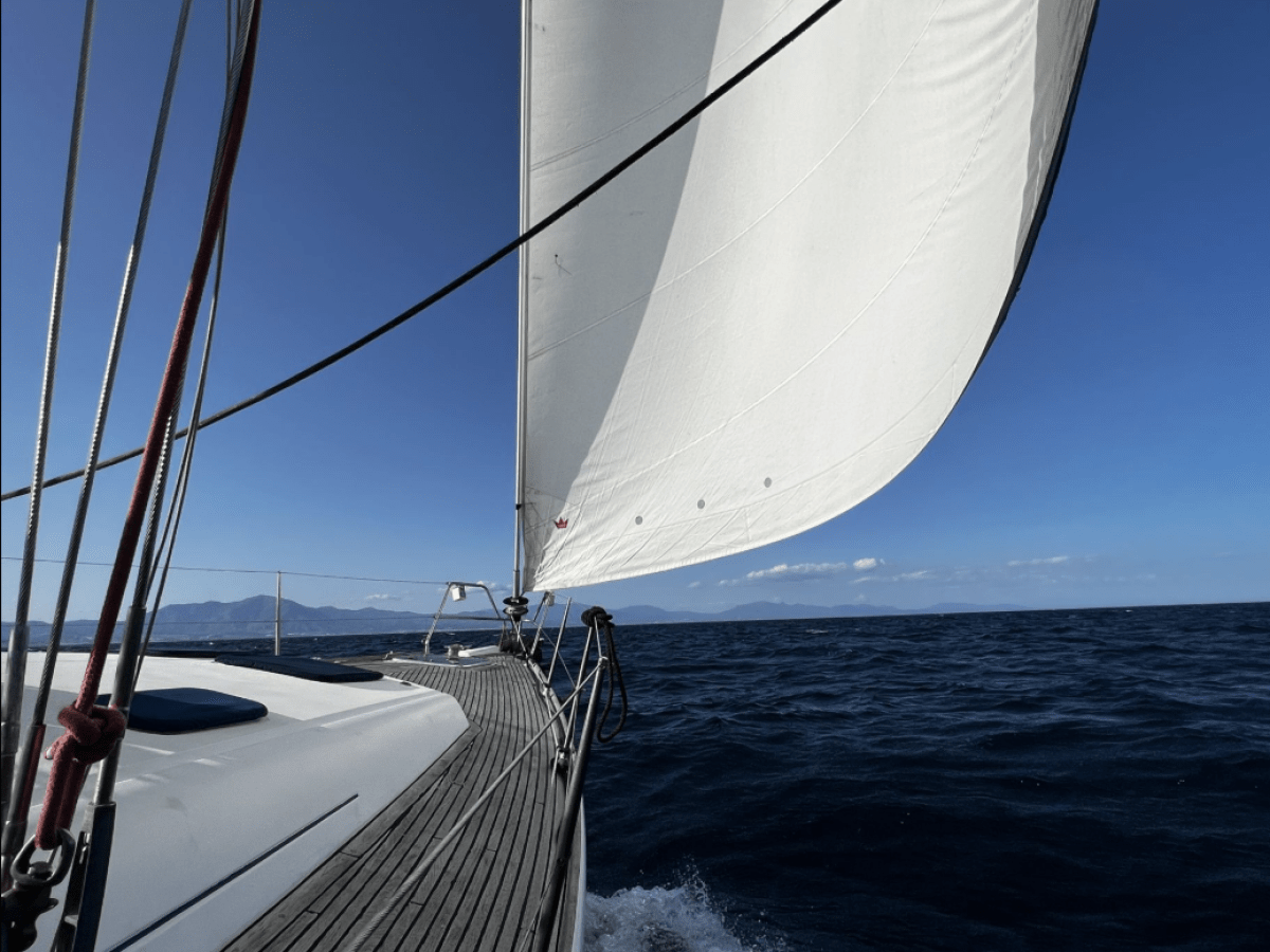 a close up of a boat next to a body of water