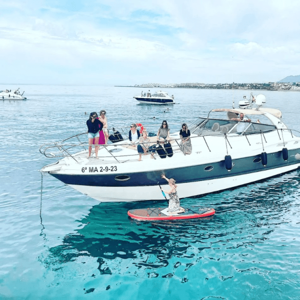 a group of people on a boat in the water