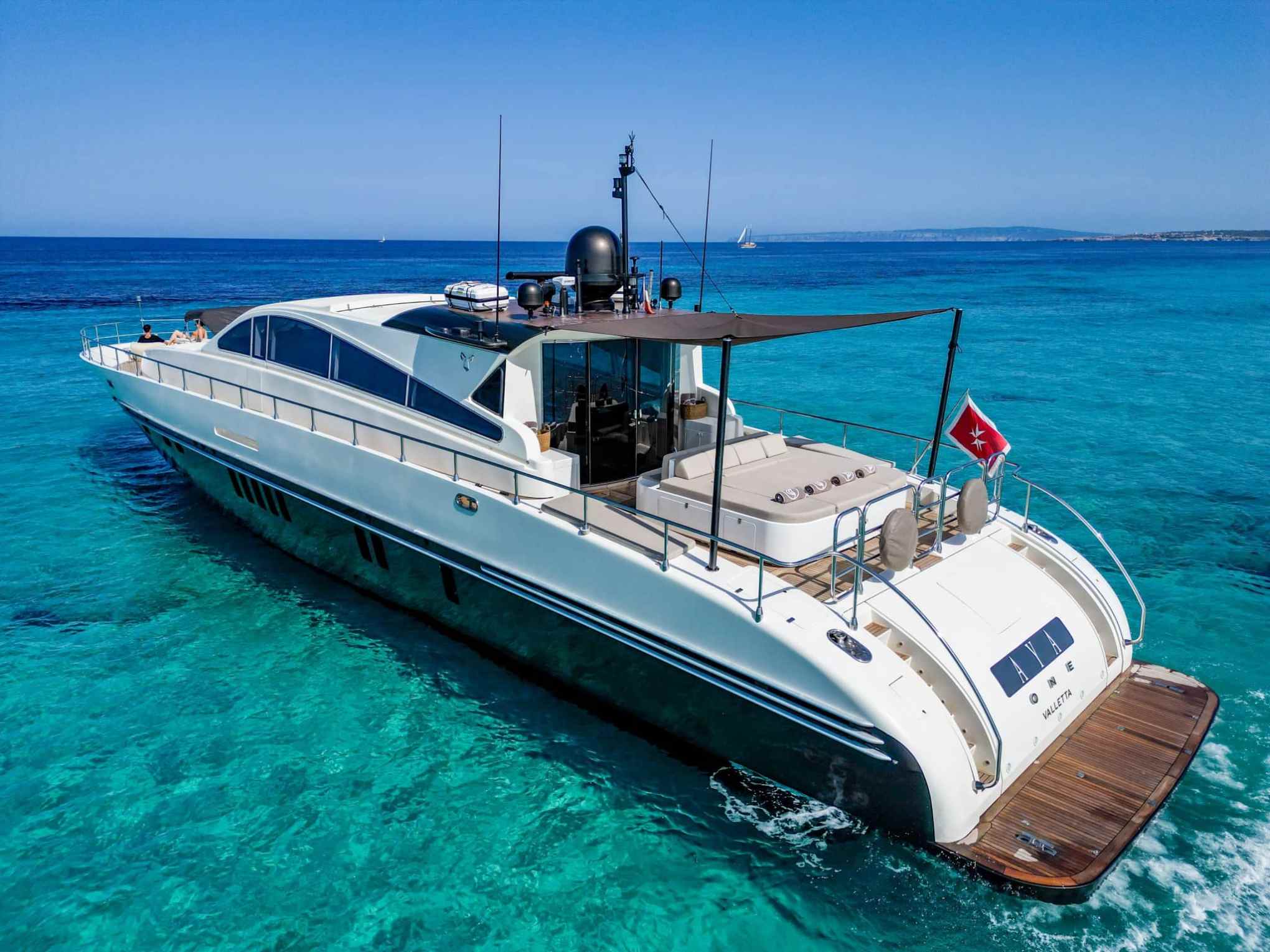 a boat is docked next to a body of water