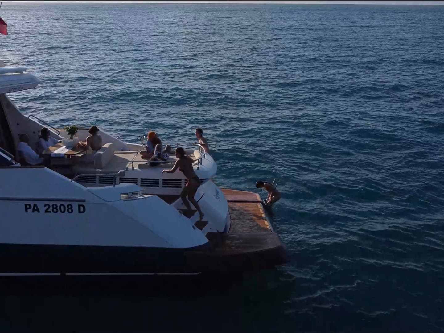 a group of people in a boat on a body of water
